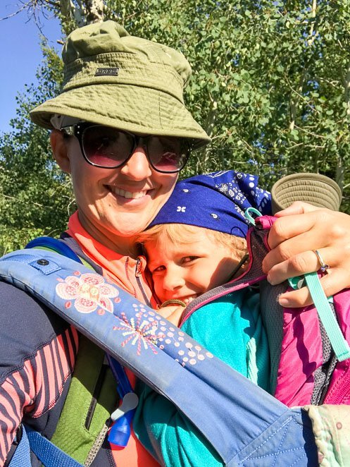 Mom and daughter hiking Hidden Falls trail Grand Teton National Park