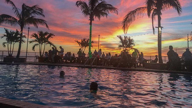 Watch the sunset at Sunset Grille in the pool