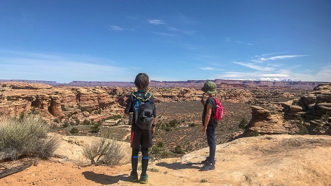 Visiting Utah National Parks with Kids - hiking with kids at Canyonlands_