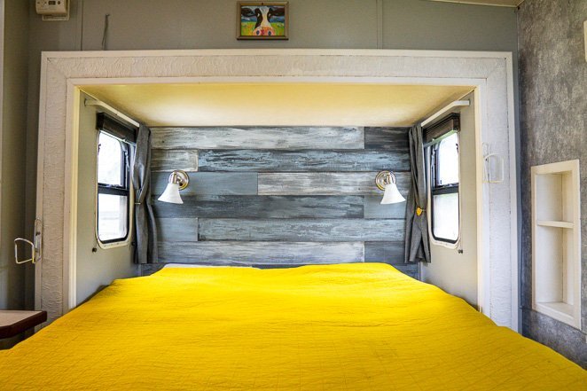 https://www.letstravelfamily.com/wp-content/uploads/2020/07/RV-bed-with-yelllow-blanket-2.jpg